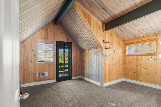a view of a house with a door and wooden floor