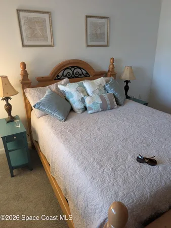 a bedroom with bed and window