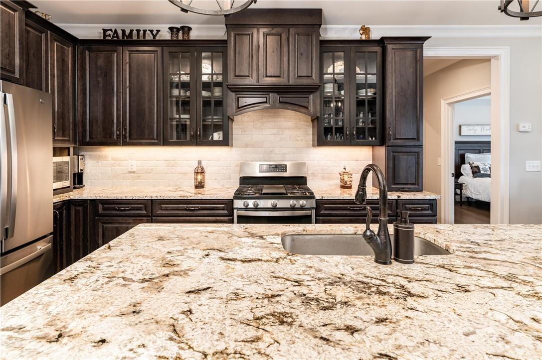 8486 Monbo Road Catawba, NC 28609 - Photo 12 of 48 a kitchen with stainless steel appliances kitchen island granite countertop a stove and cabinets