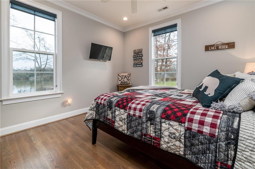 8486 Monbo Road Catawba, NC 28609 - Photo 21 of 48 a bedroom with a bed a window and a flat screen television