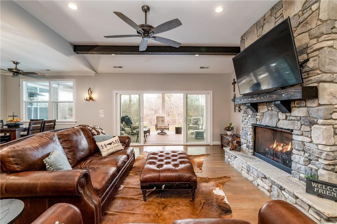 8486 Monbo Road Catawba, NC 28609 - Photo 8 of 48 a living room with furniture a flat screen tv and a fireplace