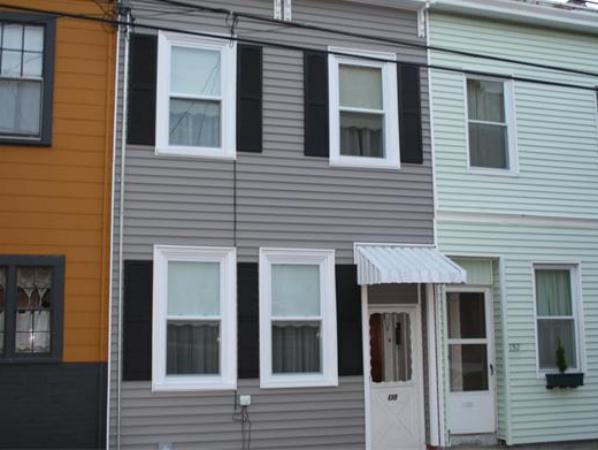 130 Spring Street Cambridge, MA 02141 - Photo 1 of 1 a view of a brick house with large windows