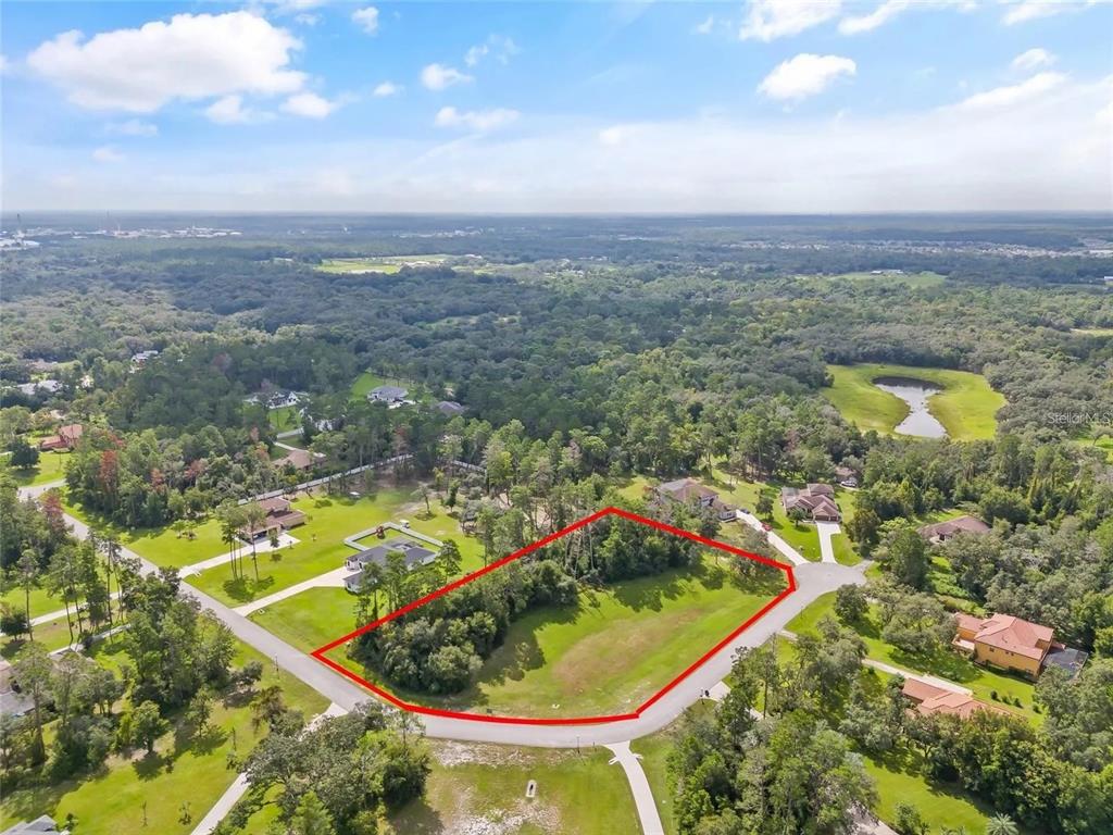 13615 Gopher Pond Court Hudson, FL 34669 - Photo 7 of 10 an aerial view of residential houses with outdoor space and swimming pool