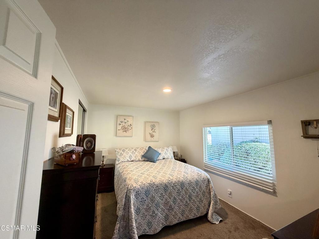 6480 Katherine Road, Unit 6 Simi Valley, CA 93063 - Photo 15 of 34 a bedroom with a bed and a window