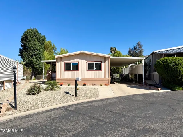a front view of a house with a patio