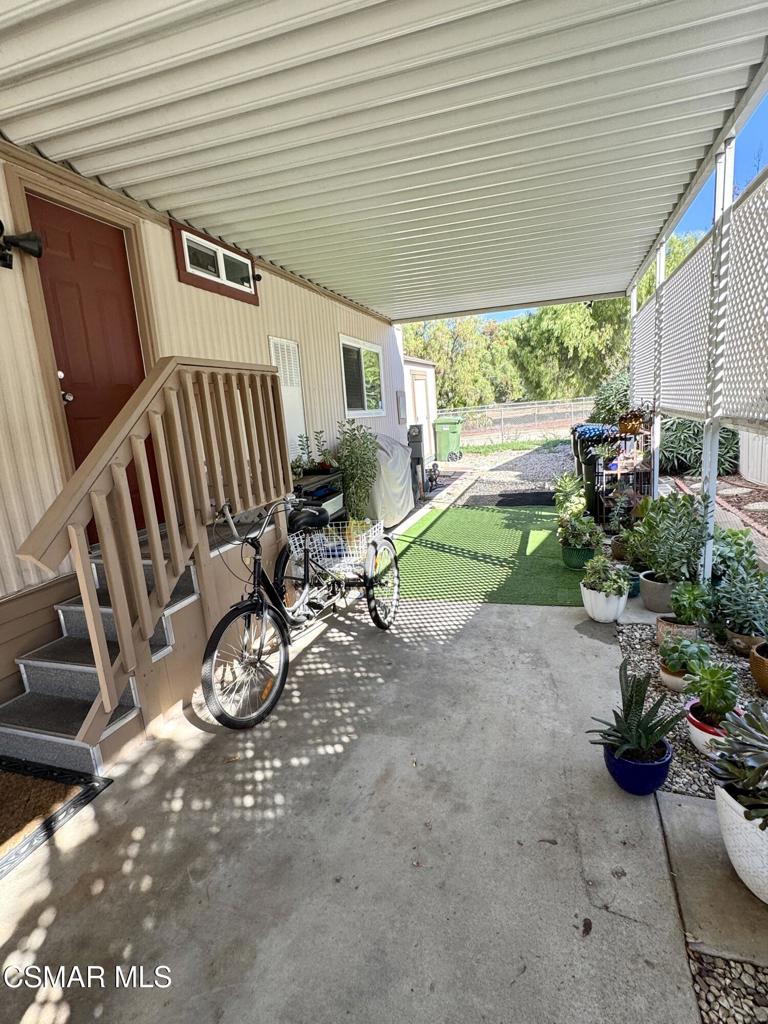 6480 Katherine Road, Unit 6 Simi Valley, CA 93063 - Photo 21 of 34 a view of a chair and table in backyard
