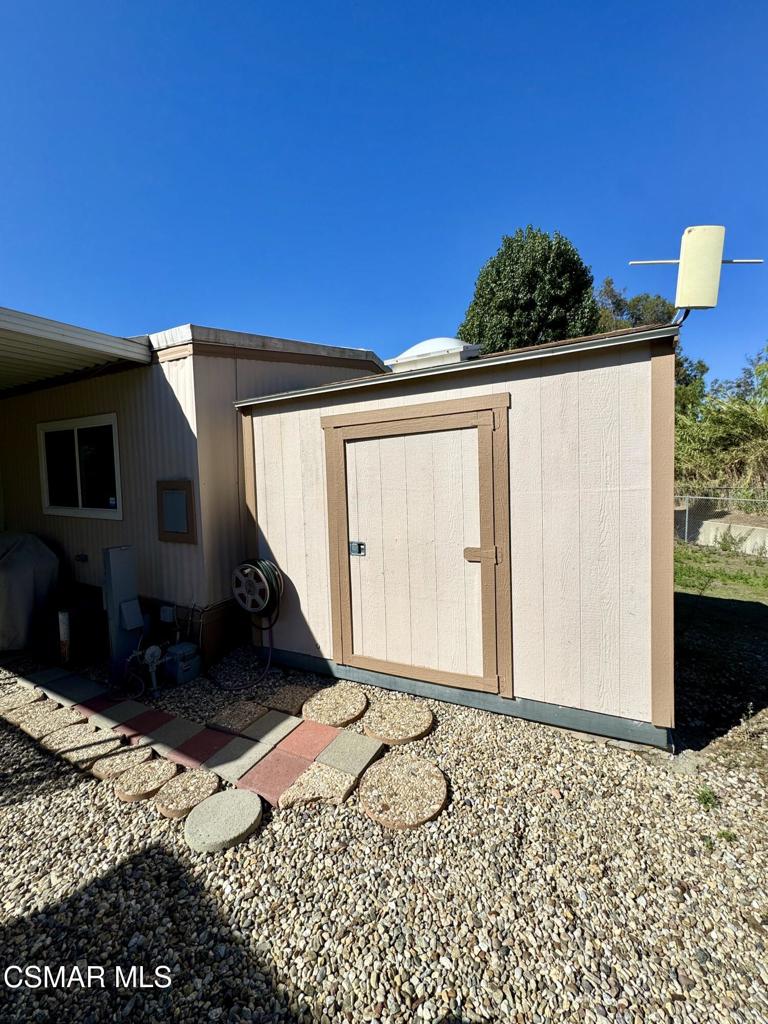 6480 Katherine Road, Unit 6 Simi Valley, CA 93063 - Photo 22 of 34 a front view of a house with a yard