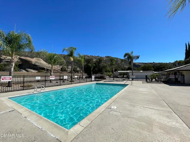 a view of swimming pool from a lounge chair