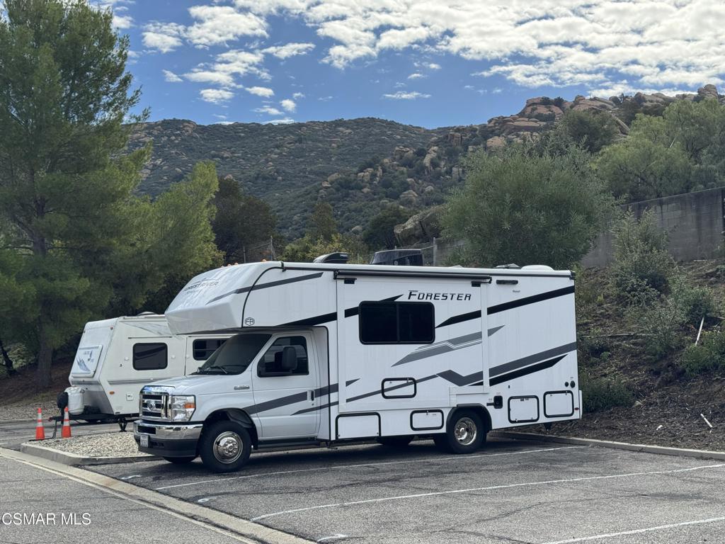6480 Katherine Road, Unit 6 Simi Valley, CA 93063 - Photo 31 of 34 a car parked on the side of a road