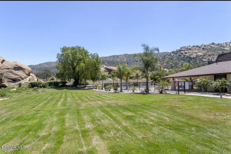 6480 Katherine Road, Unit 6 Simi Valley, CA 93063 - Photo 33 of 34 a view of a big house with a big yard and large trees