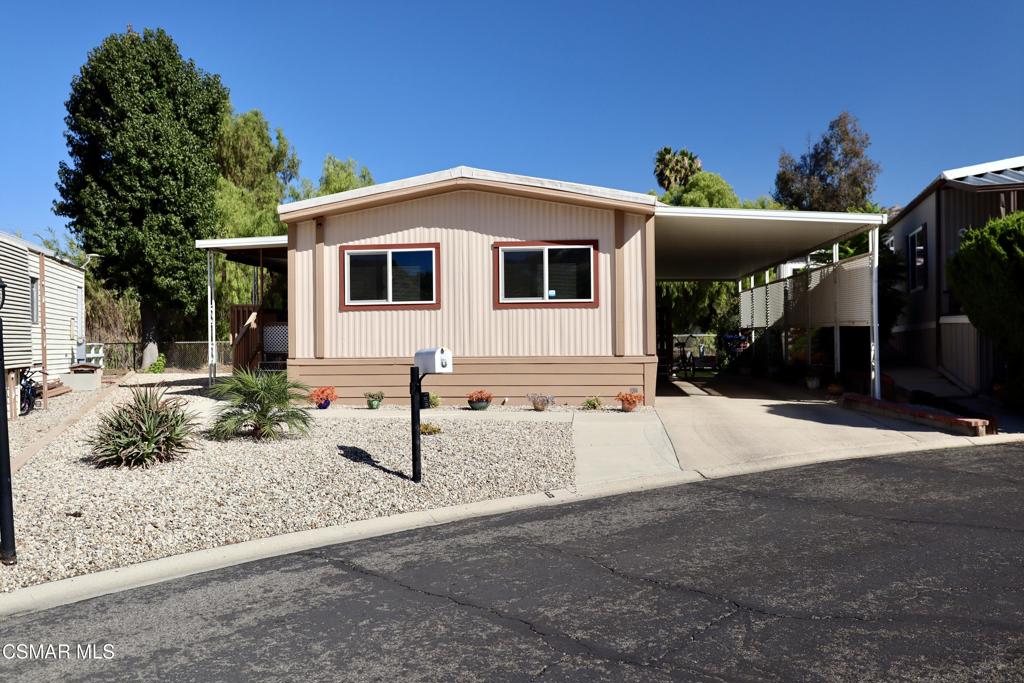 6480 Katherine Road, Unit 6 Simi Valley, CA 93063 - Photo 4 of 34 a front view of a house with a yard