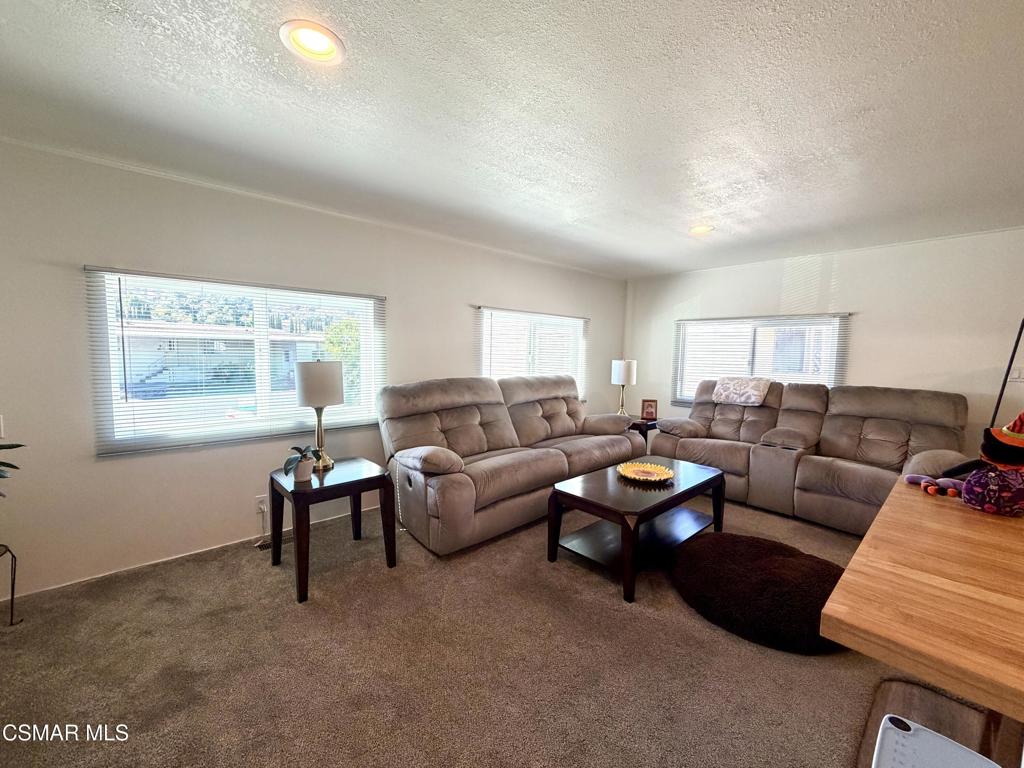 6480 Katherine Road, Unit 6 Simi Valley, CA 93063 - Photo 5 of 34 a living room with furniture and a window
