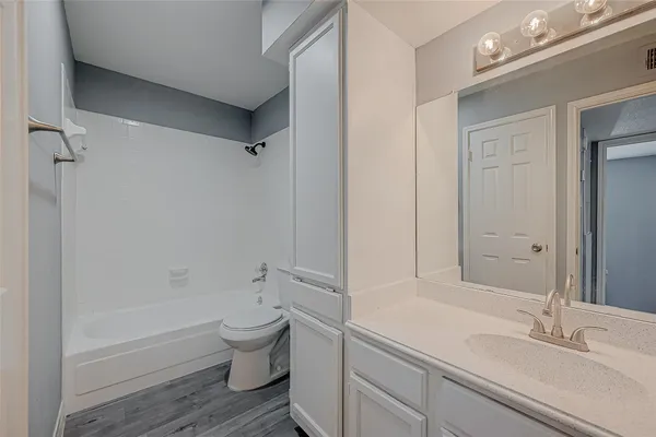 a bathroom with a toilet and a bathtub
