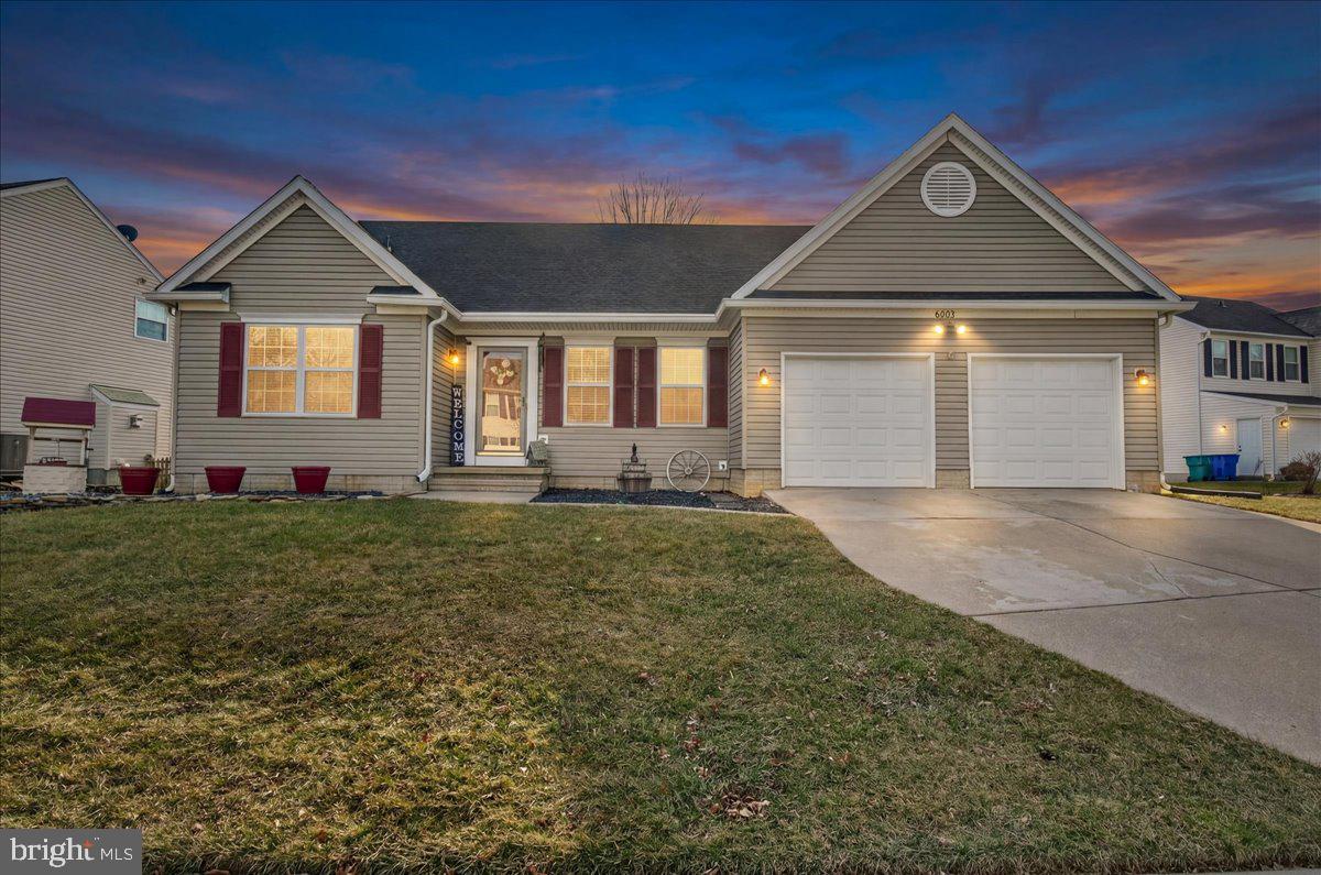6303 Edgeware Court Frederick, MD 21703 - Photo 1 of 74 a front view of a house with a yard and garage