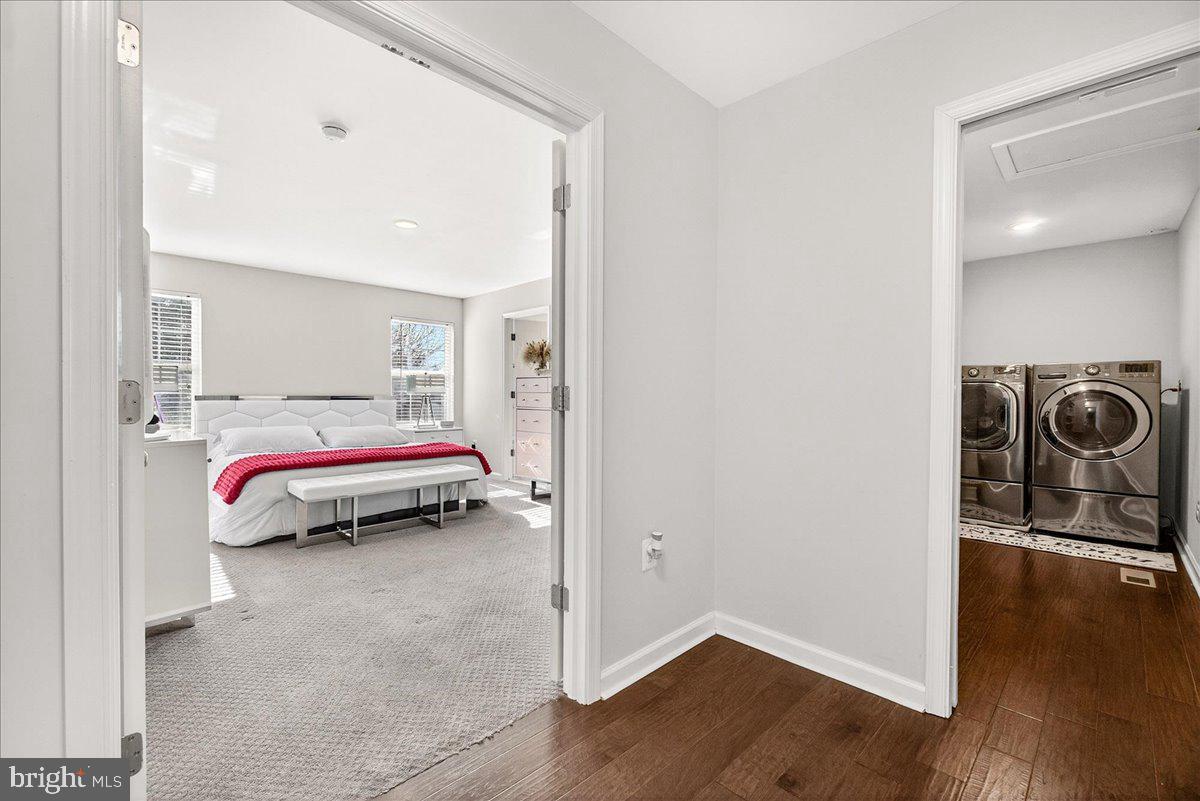 6303 Edgeware Court Frederick, MD 21703 - Photo 26 of 74 a bedroom with a bed and wooden floor