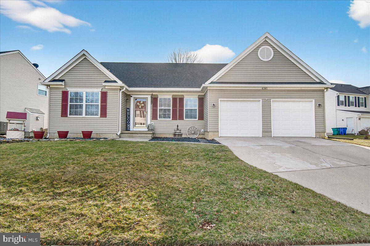 6303 Edgeware Court Frederick, MD 21703 - Photo 4 of 74 a front view of a house with a yard and garage