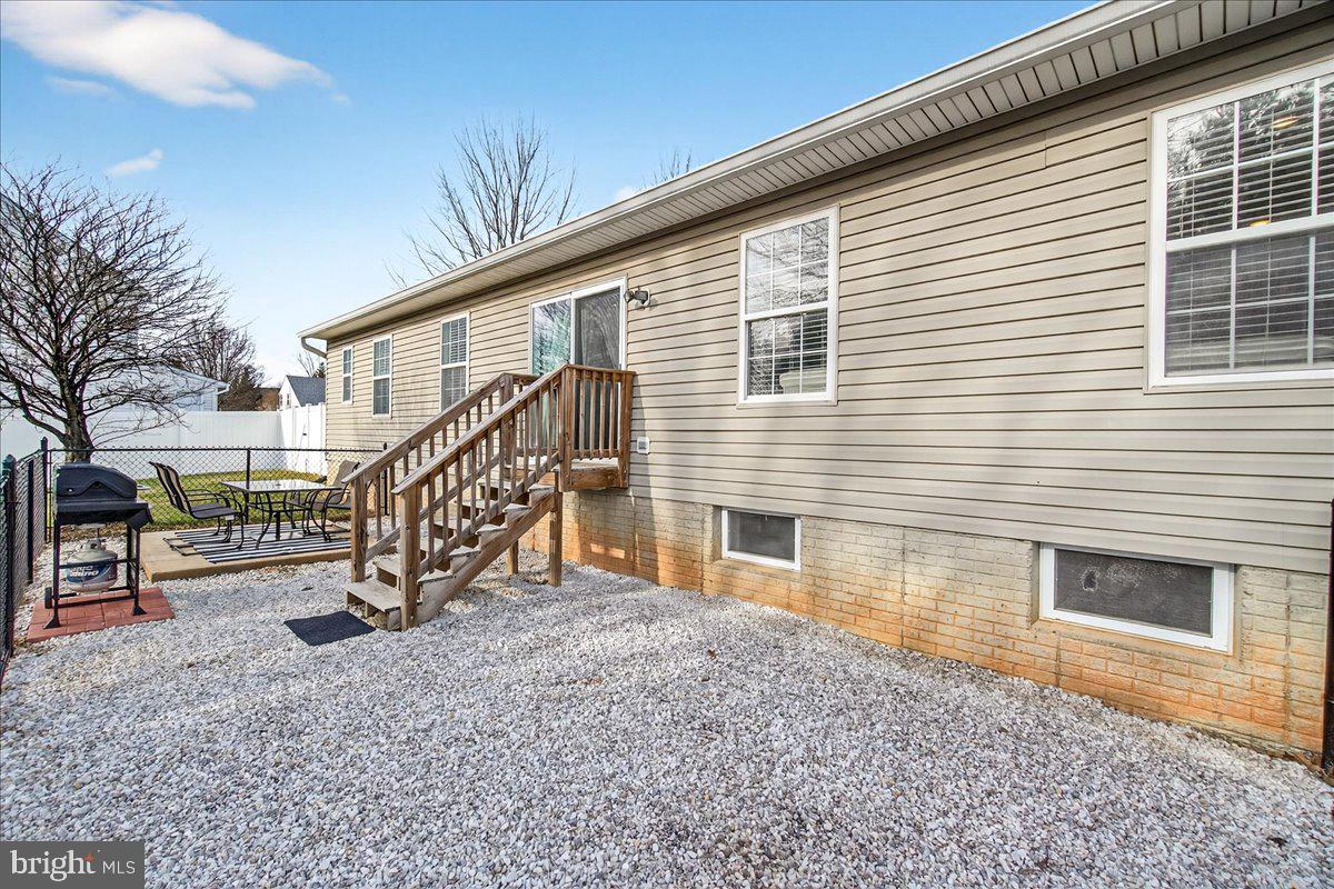 6303 Edgeware Court Frederick, MD 21703 - Photo 45 of 74 a view of a house with a yard