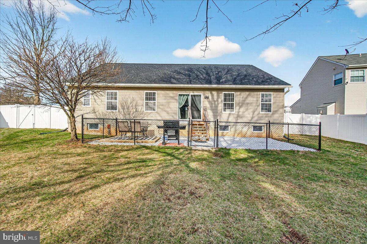 6303 Edgeware Court Frederick, MD 21703 - Photo 48 of 74 a view of a house with backyard and a tree