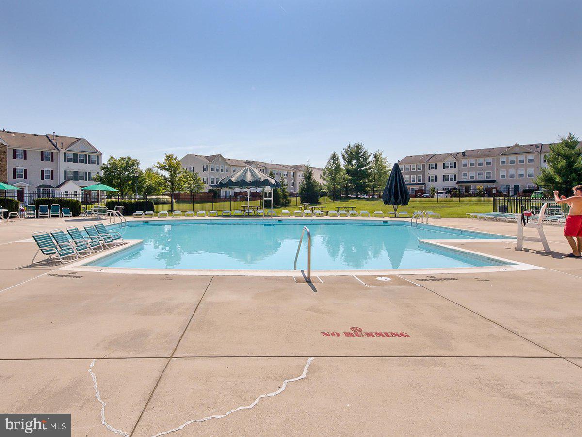 6303 Edgeware Court Frederick, MD 21703 - Photo 52 of 74 a view of a swimming pool and an outdoor space