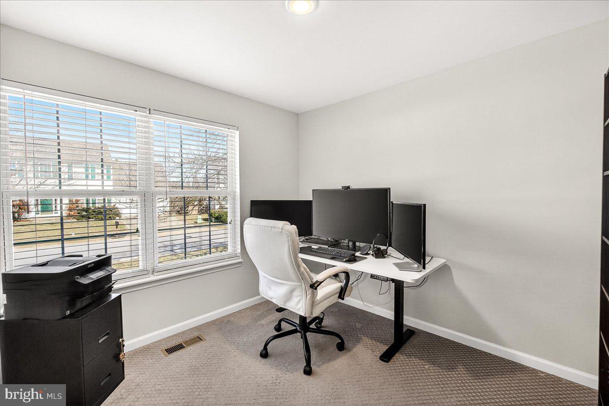 6303 Edgeware Court Frederick, MD 21703 - Photo 7 of 74 a view of a workspace with furniture and a window