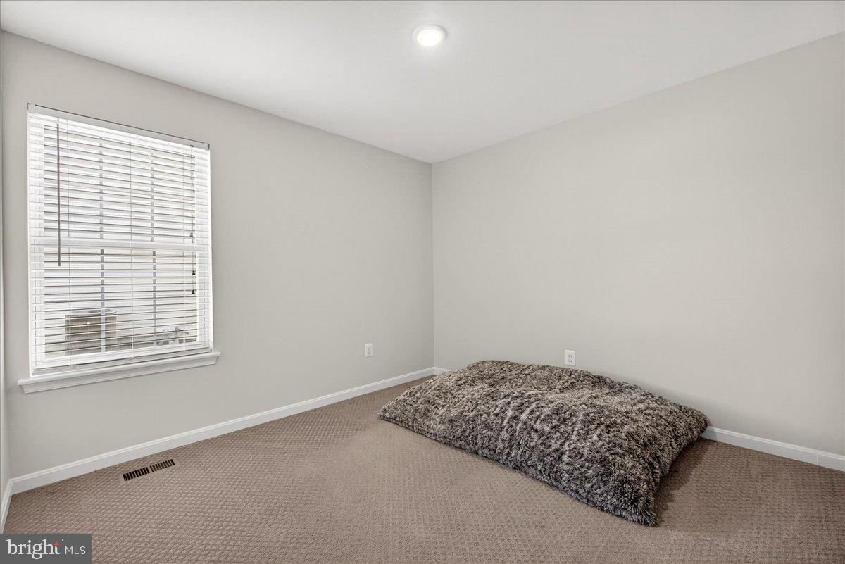 6303 Edgeware Court Frederick, MD 21703 - Photo 9 of 74 a room with a bed and a window