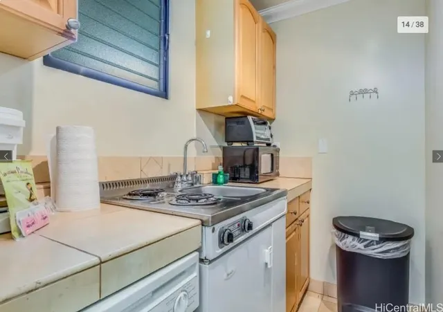 a kitchen with a stove and a microwave