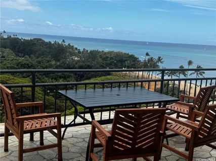 a terrace with outdoor seating and city view