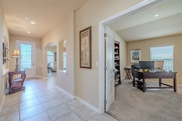 a view of a livingroom with furniture and a window
