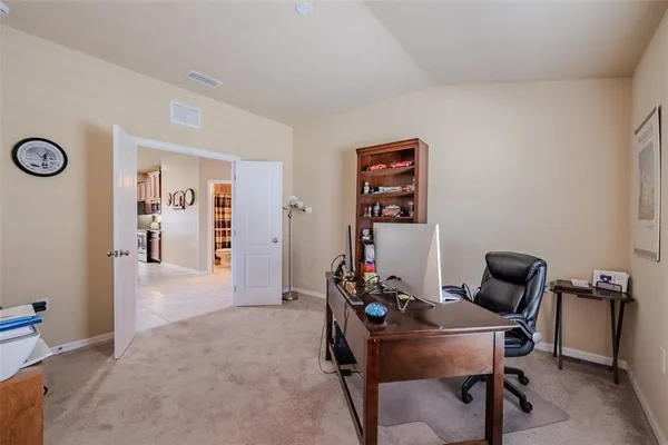 a view of a workspace with furniture