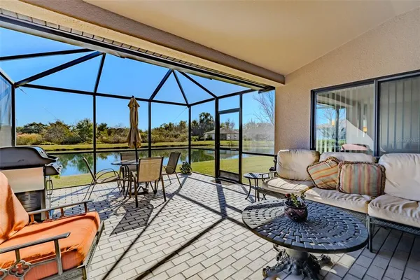 a view of a chairs and table in patio