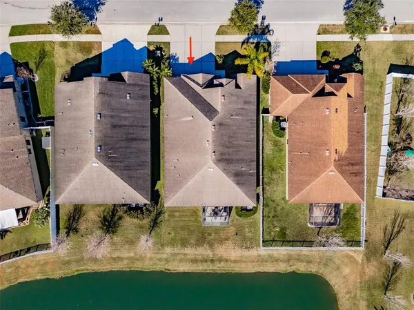 an aerial view of houses with outdoor space