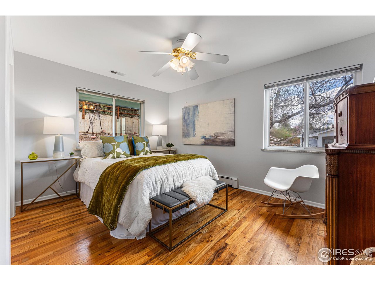 3880 Cloverleaf Drive Boulder, CO 80304 - Photo 18 of 38 a bedroom with a bed and wooden floor