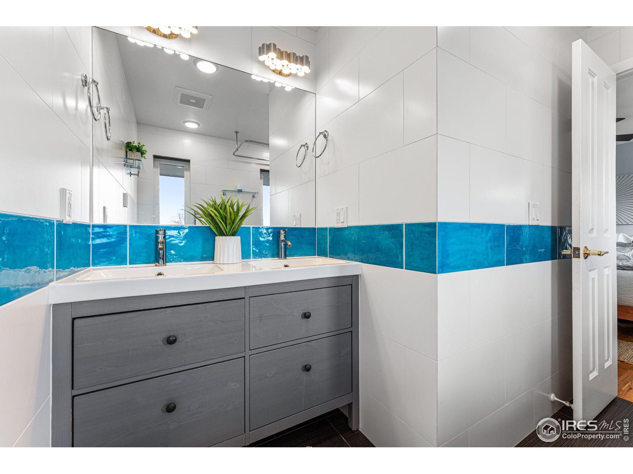 3880 Cloverleaf Drive Boulder, CO 80304 - Photo 25 of 38 a bathroom with a sink and a mirror