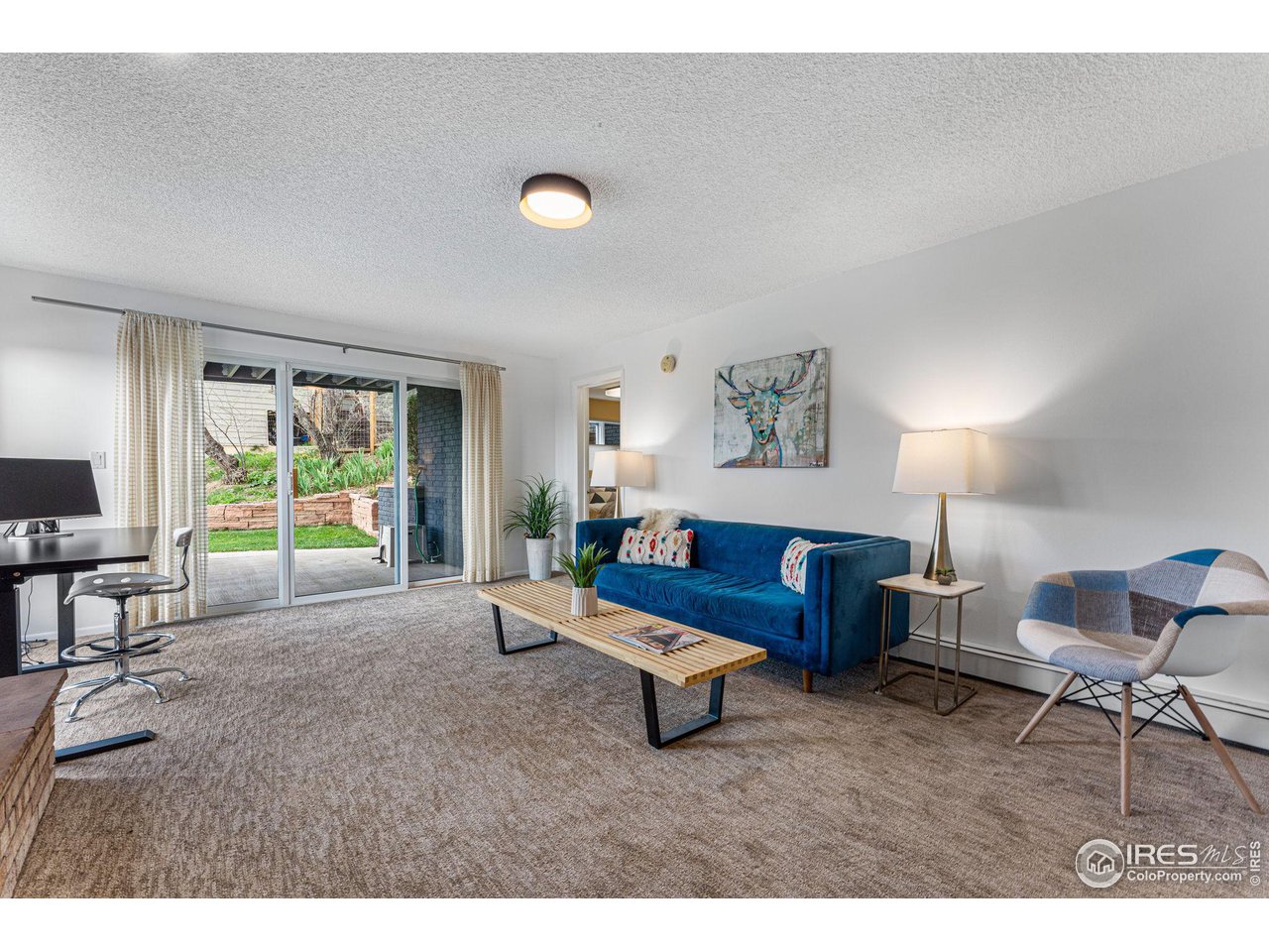 3880 Cloverleaf Drive Boulder, CO 80304 - Photo 26 of 38 a living room with furniture and a large window