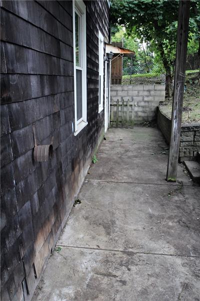2311 Spring Street Pittsburgh, PA 15210 - Photo 5 of 24 Small walkway along side and back of house