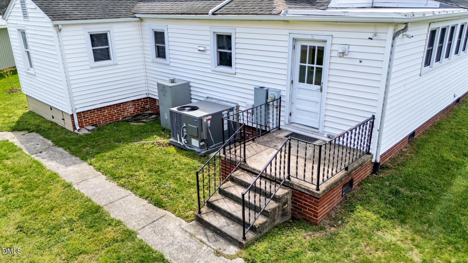 414 South Maple Street Graham, NC 27253 - Photo 41 of 42 a view of a house with a yard and deck