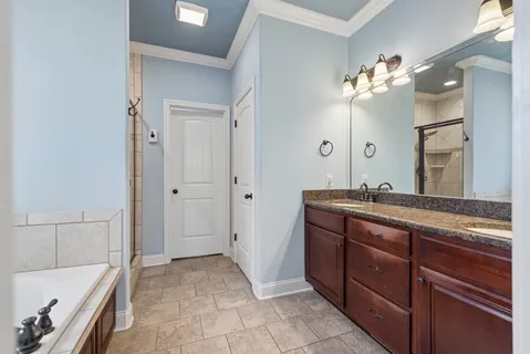 a bathroom with a bathtub and a toilet