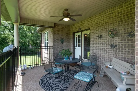 a front view of house with a garden and porch