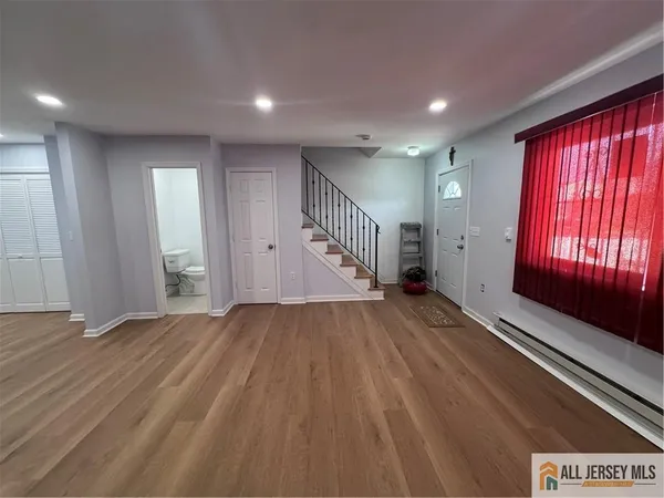 wooden floor in an empty room with windows