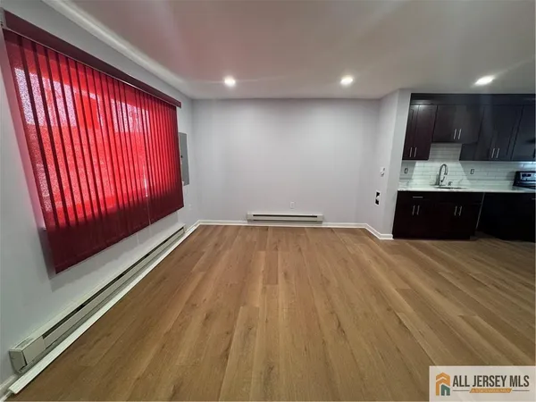 a view of kitchen with microwave and window
