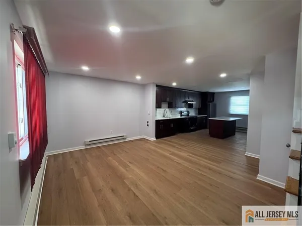 a view of kitchen and refrigerator