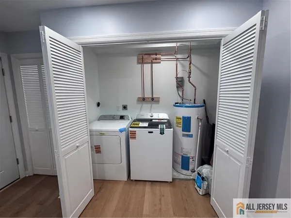 a view of a storage & utility room with washer and dryer