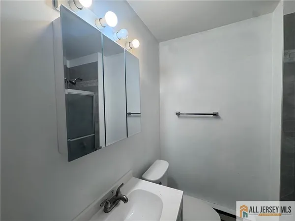 a bathroom with a toilet and a sink