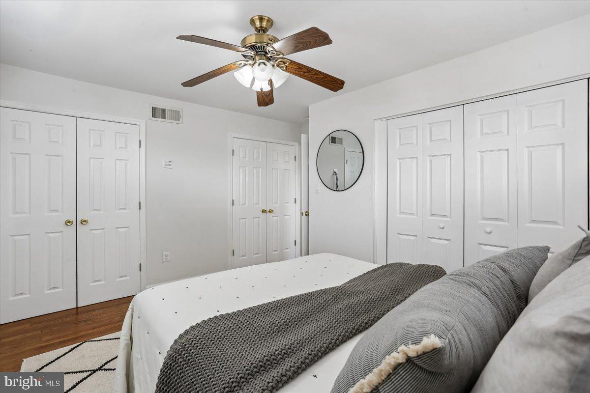 3709 Kenway Street Silver Spring, MD 20906 - Photo 22 of 34 a bedroom with a large bed and a chandelier
