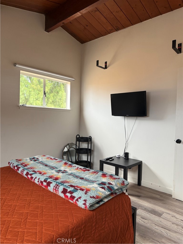 6922 Datura Avenue Twentynine Palms, CA 92277 - Photo 12 of 24 a bedroom with a bed and a table in it