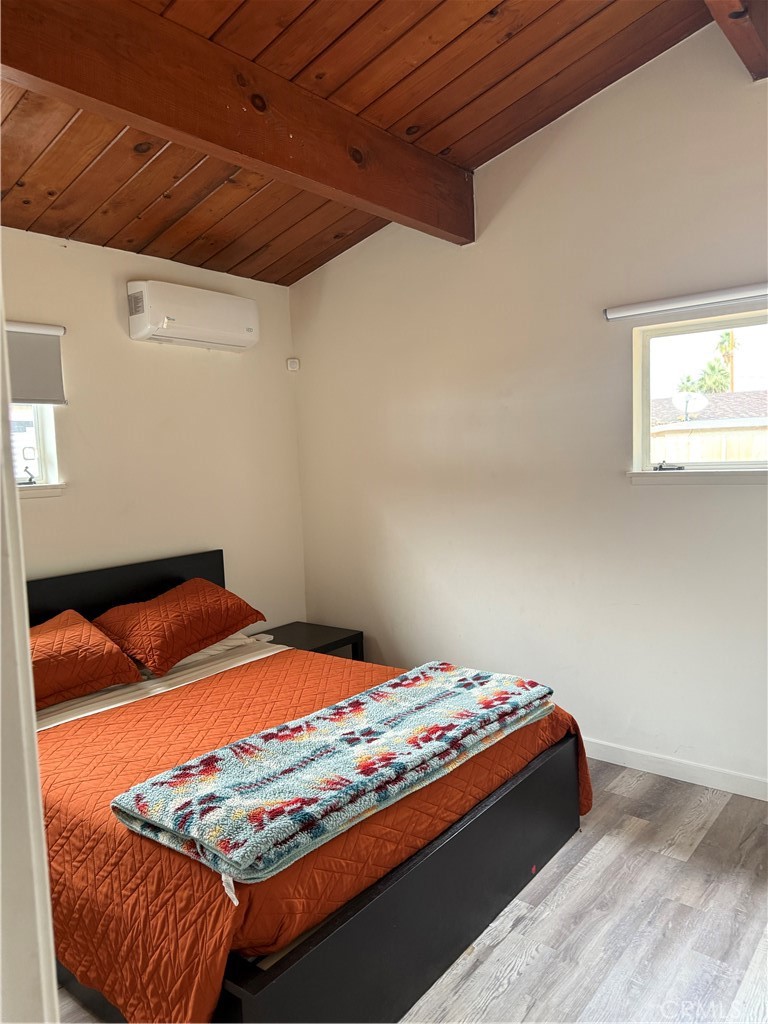 6922 Datura Avenue Twentynine Palms, CA 92277 - Photo 13 of 24 a bedroom with a bed and a window