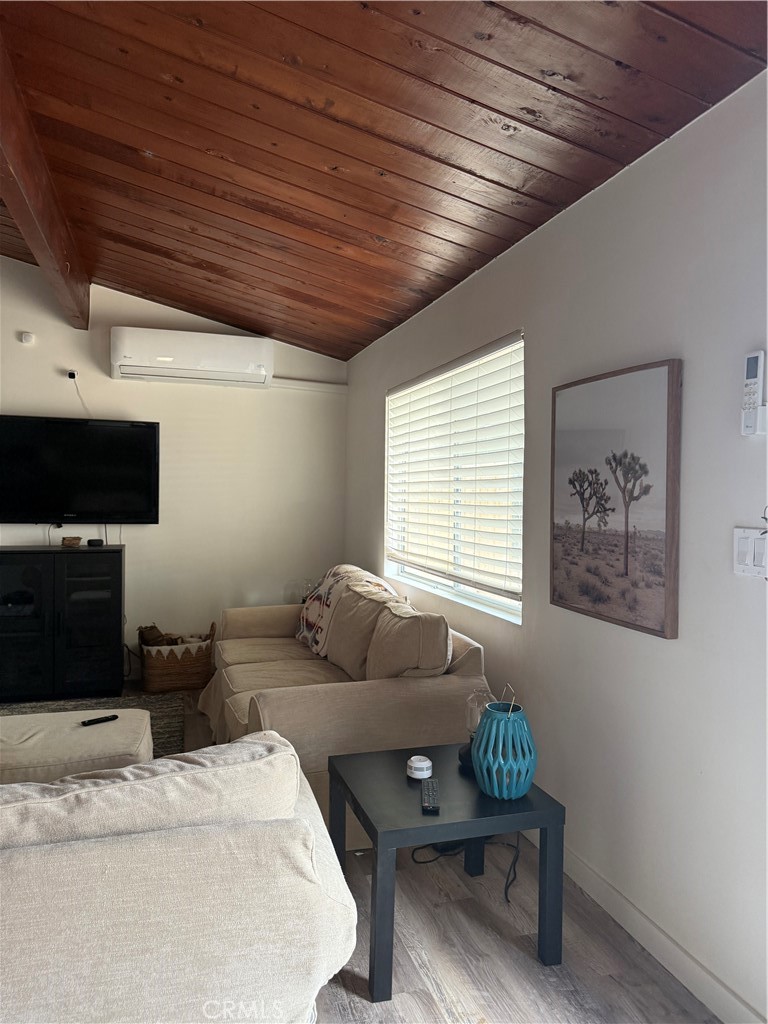 6922 Datura Avenue Twentynine Palms, CA 92277 - Photo 6 of 24 a bedroom with furniture and a window