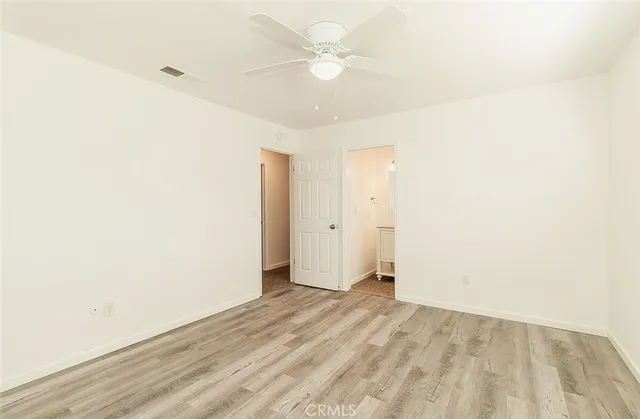 a bathroom with a sink a toilet a mirror and shower