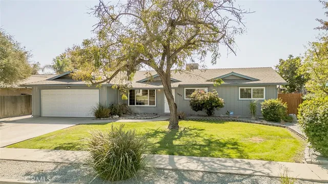 a house view with swimming pool in front of house
