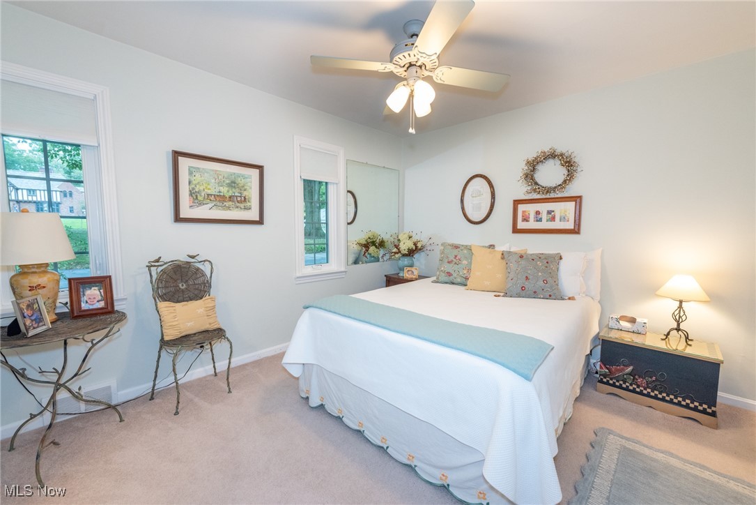 911 Merriman Road Akron, OH 44303 - Photo 26 of 48 Bedroom featuring light carpet and ceiling fan
